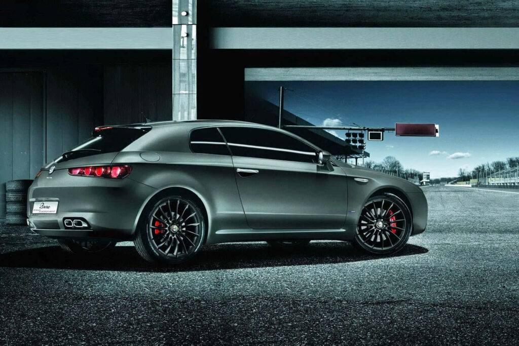 Alfa Romeo Brera on open road showcasing modern design sporty appeal dynamic automotive wallpaper