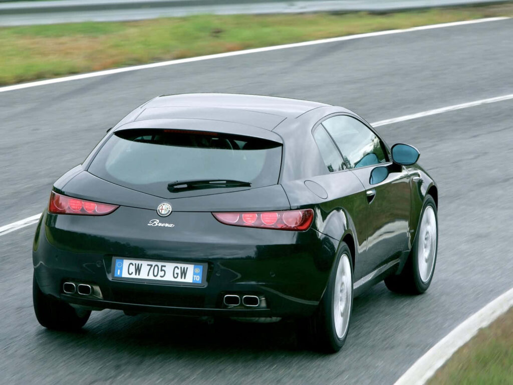 Alfa Romeo Brera speeding on wet curving road dynamic wallpaper sporty agile performance