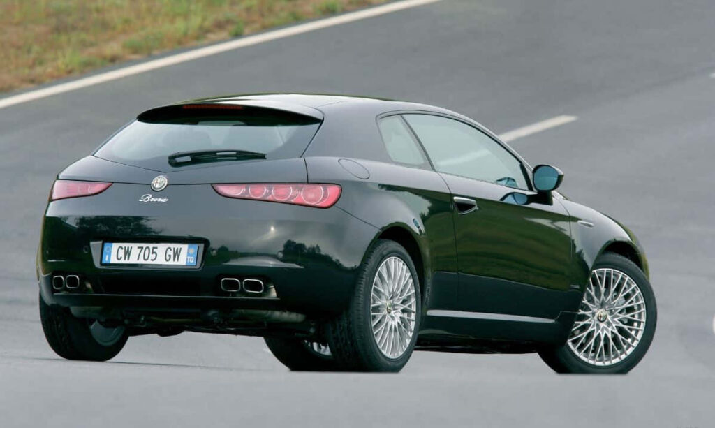 Alfa Romeo Brera in motion on winding road showcasing dynamic design and sporty character Wallpaper