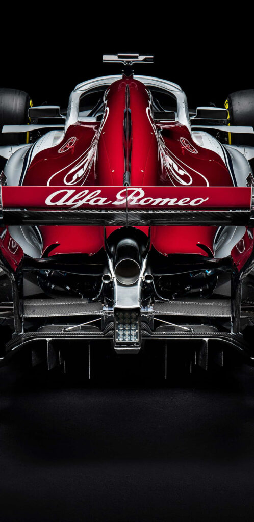 Rear view of Alfa Romeo F1 2018 car red livery showcasing sleek design and advanced aerodynamics Wallpaper
