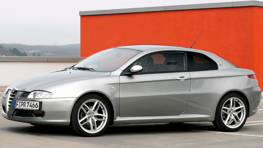 Alfa Romeo GT silver coupe sleek Italian performance car modern urban wallpaper background