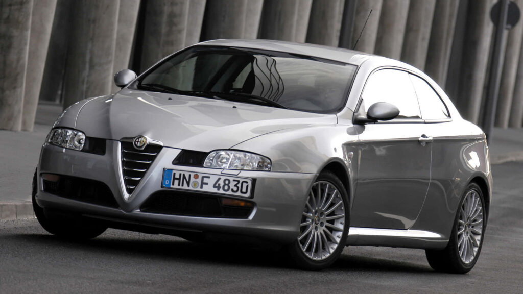 Alfa Romeo GT in urban setting highlighting sleek design and sporty elegant lines wallpaper