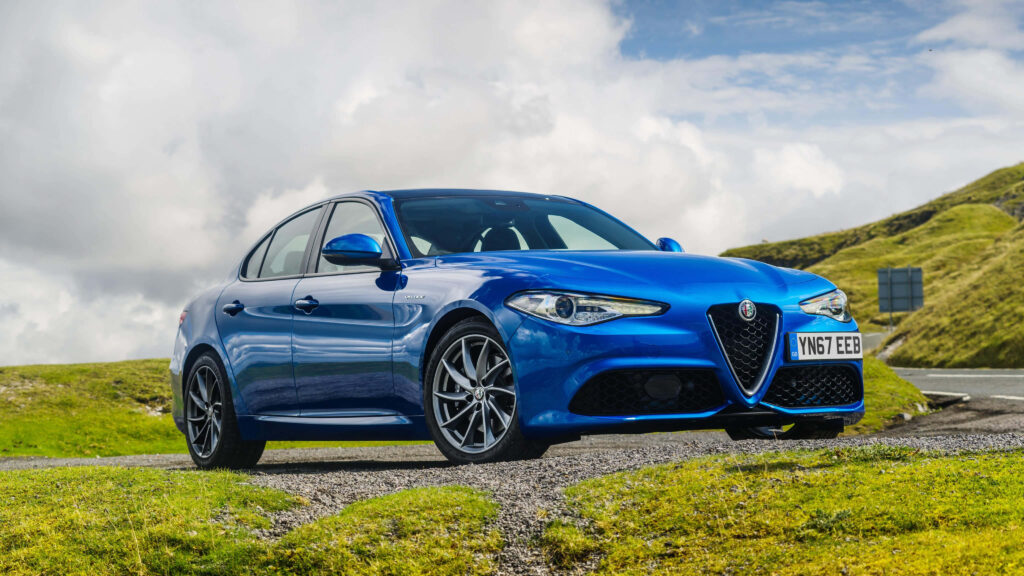 Alfa Romeo Giulia elegant design sporty car scenic outdoor wallpaper background image