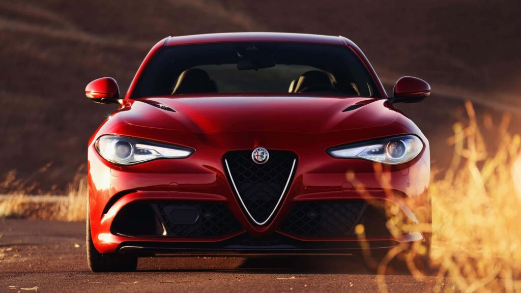Alfa Romeo Giulia sleek design urban background modern elegant sporty car wallpaper
