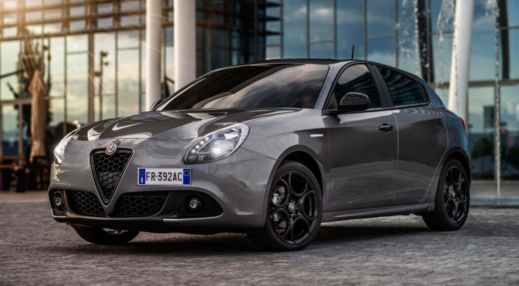 Alfa Romeo Giulietta with metallic finish parked in urban setting modern sleek design wallpaper