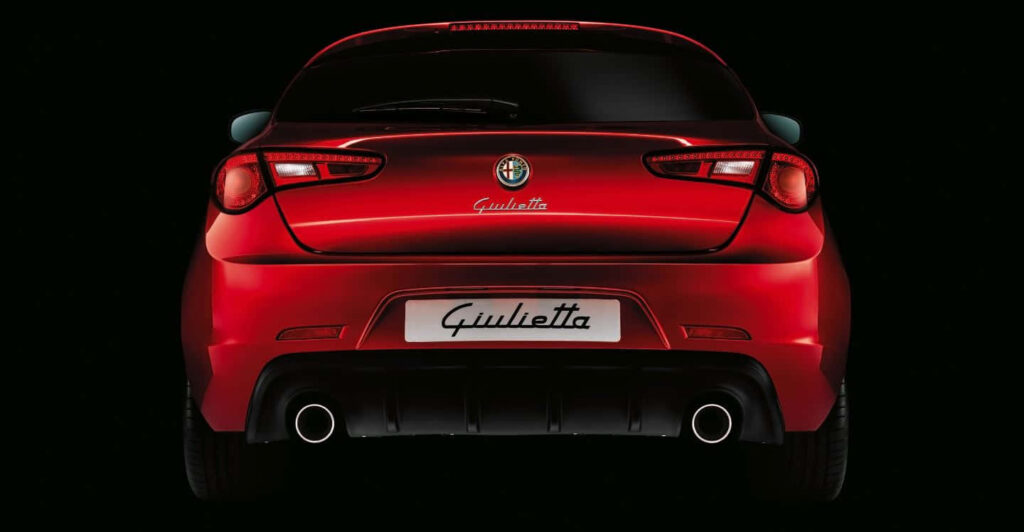 Rear view of Alfa Romeo Giulietta showcasing sleek sporty design and dynamic curves on dark background Wallpaper