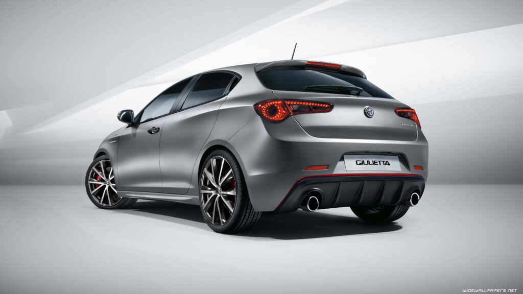 Alfa Romeo Giulietta in motion showcasing sporty design and sleek modern car wallpaper background