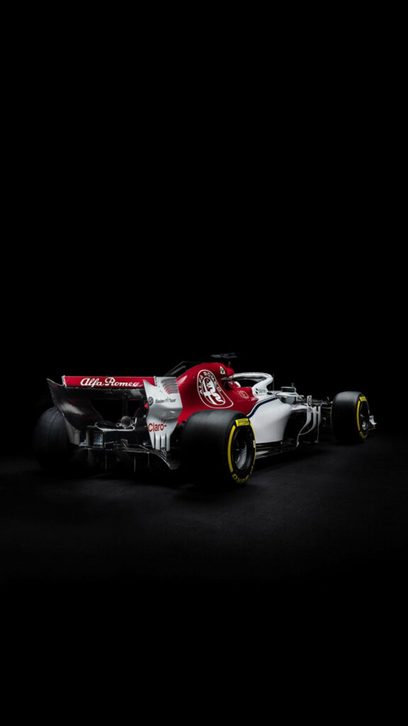 Alfa Romeo Sauber C37 2018 Formula 1 car wallpaper with dynamic dark background design