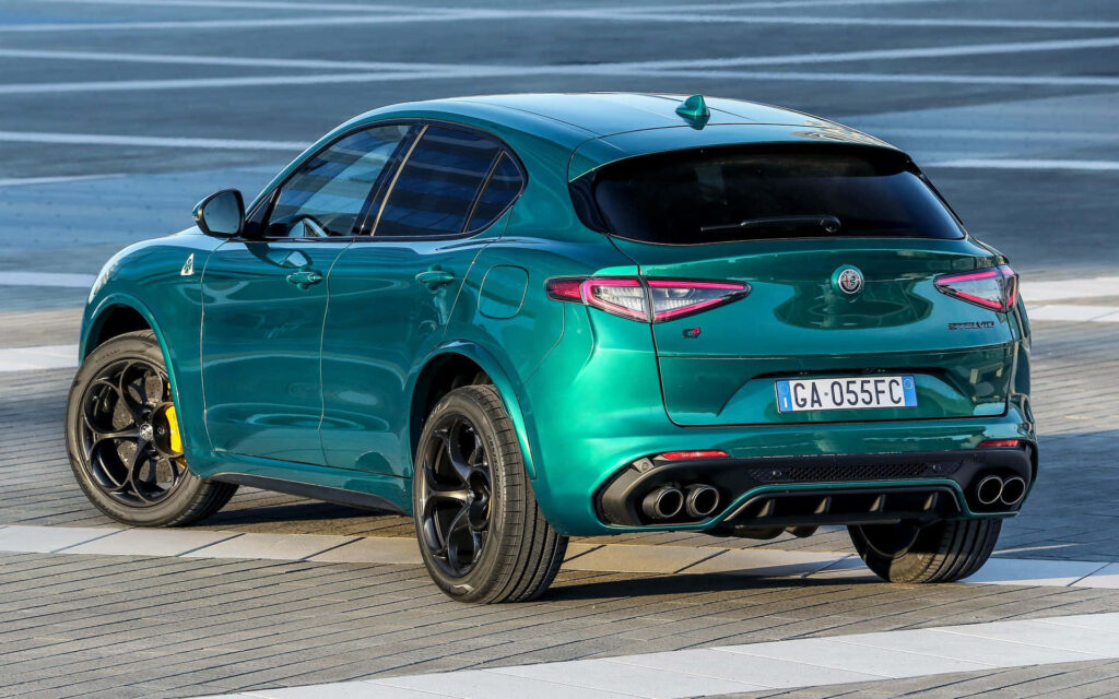 Alfa Romeo Stelvio sleek powerful SUV wallpaper stylish performance modern road backdrop