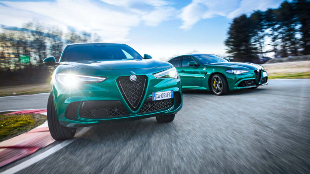 Alfa Romeo Stelvio SUV driving on scenic open road showcasing power Italian elegance wallpaper