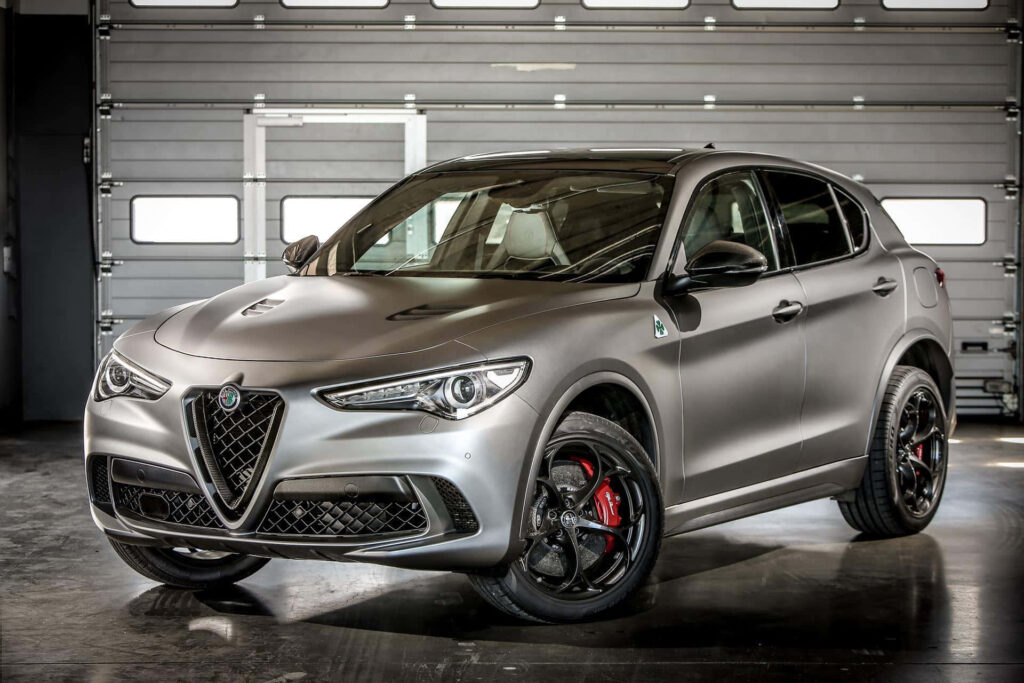 Alfa Romeo Stelvio silver SUV parked indoors with aggressive grille and sleek sporty design wallpaper