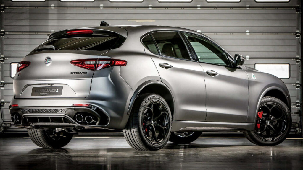 Alfa Romeo Stelvio sporty SUV with sharp design in industrial garage modern automotive background Wallpaper