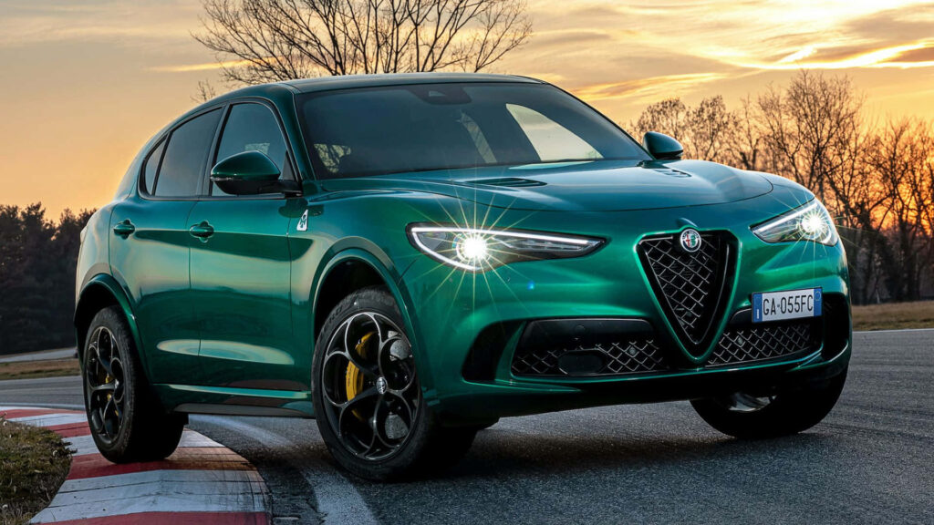 Alfa Romeo Stelvio driving at sunset elegant design dynamic performance wallpaper background