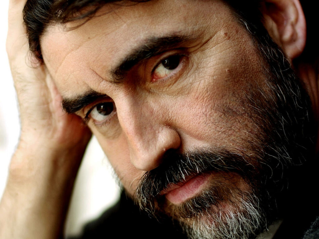 Close-up of Alfred Molina with intense thoughtful expression showcasing expressive facial features Wallpaper