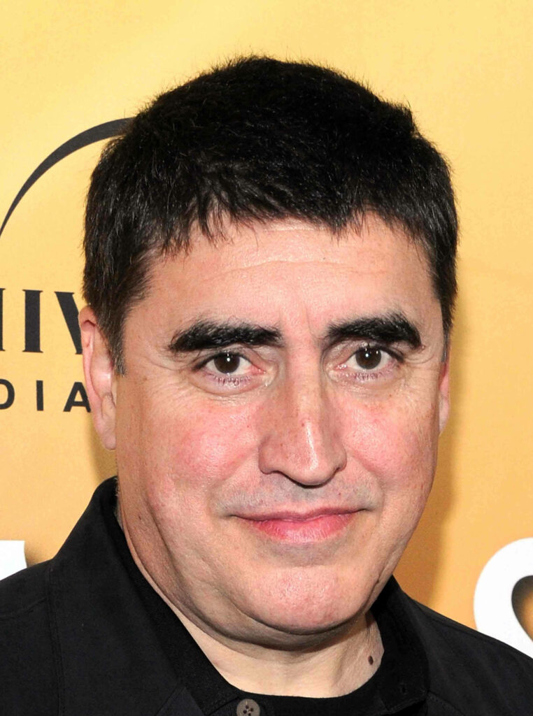 Alfred Molina portrait against warm yellow background high quality film actor wallpaper