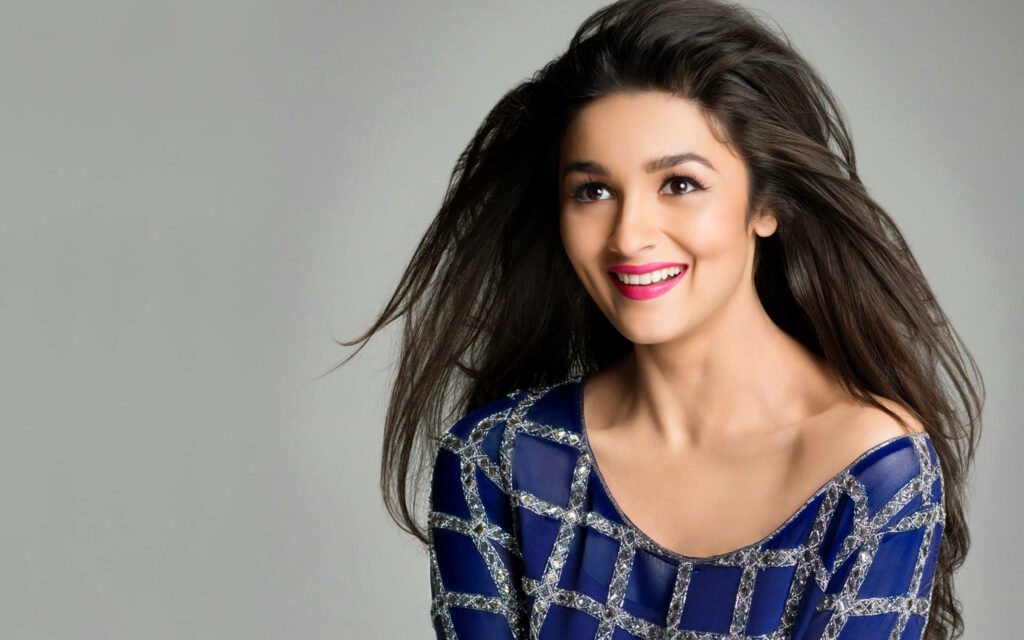 Alia Bhatt smiling in blue patterned outfit India Times 2014 wallpaper soft grey background