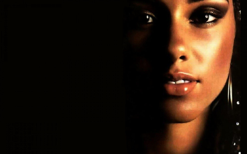 Alicia Keys dramatic portrait with half face illuminated and deep shadow artistic wallpaper background