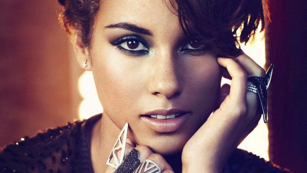 Alicia Keys short hair confident gaze striking makeup statement rings bold style wallpaper