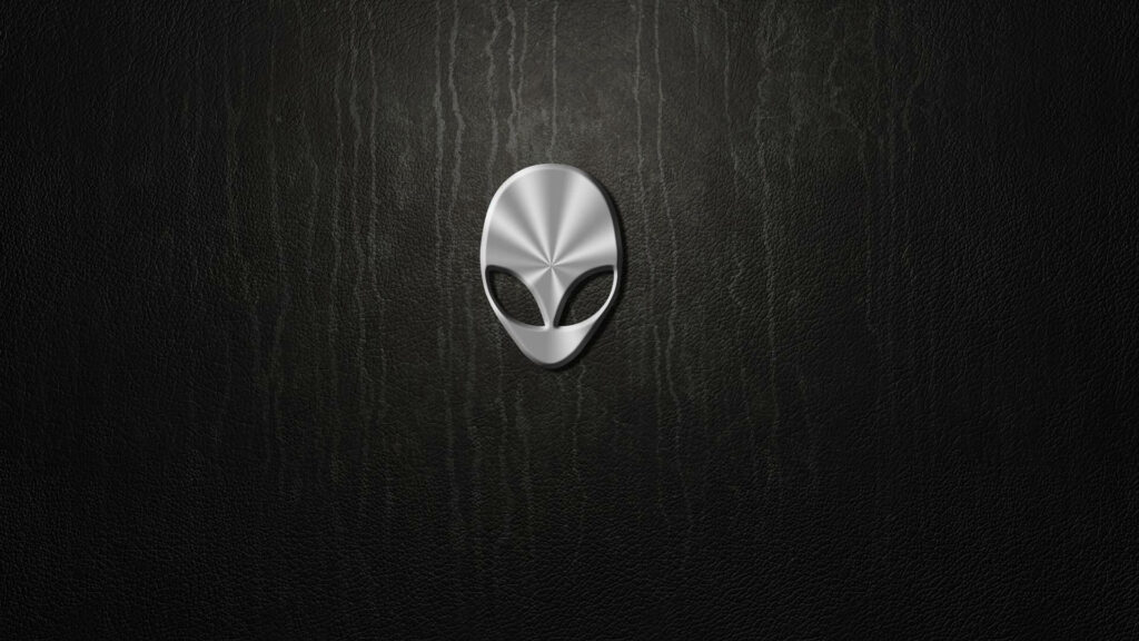 Alienware metallic alien head logo on textured black background high performance gaming wallpaper