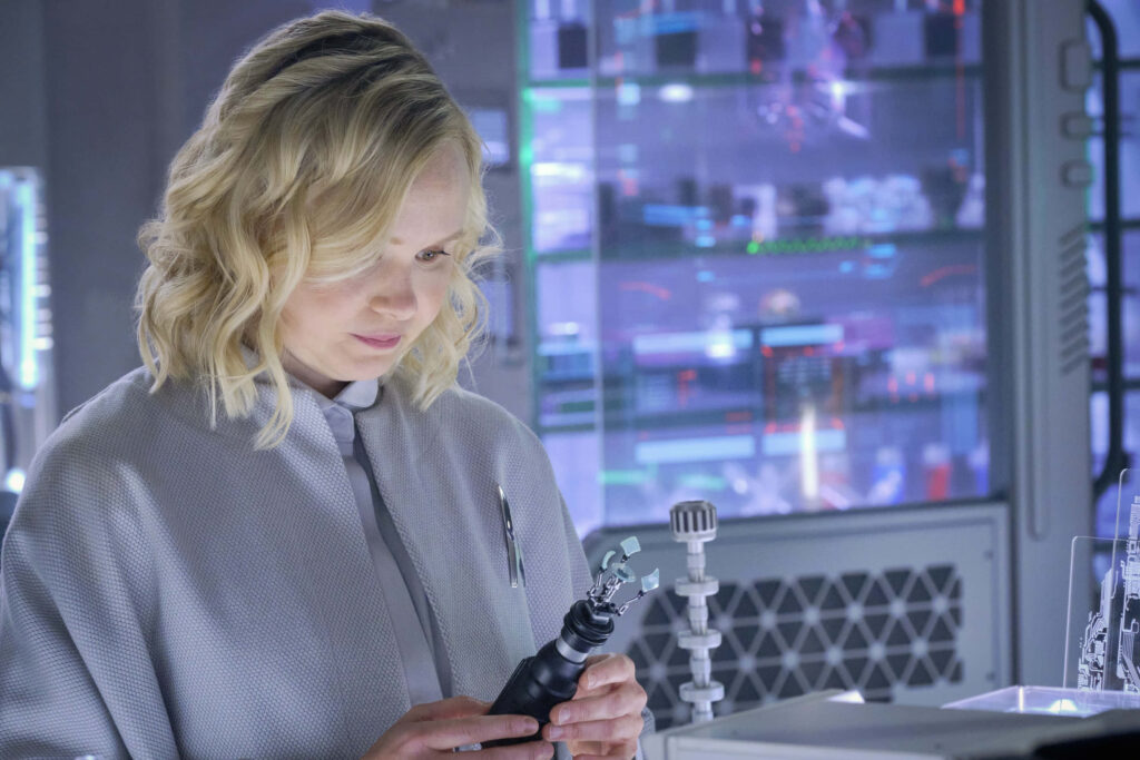 Alison Pill focused in high tech lab with scientific equipment and advanced technology background Wallpaper