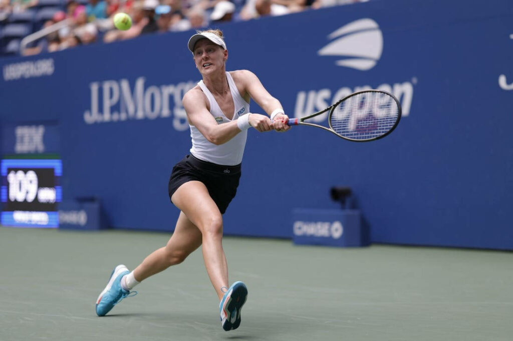 Alison Riske Amritraj focused chasing ball during intense US Open tennis match action wallpaper