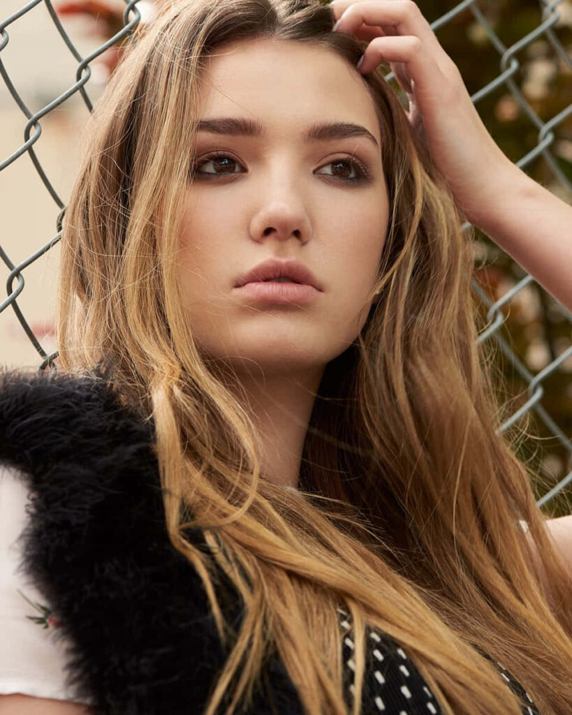Alissa Skovbye thoughtful portrait by chainlink fence expressive pensive wallpaper background