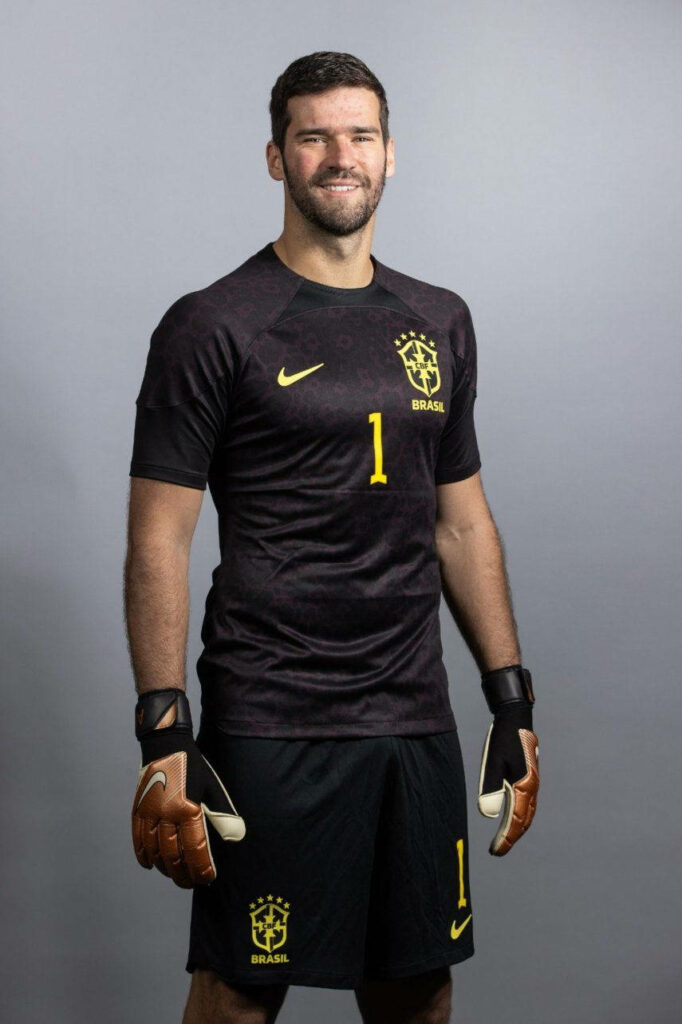 Alisson Becker in black Brazil goalkeeper jersey and gloves number 1 intense football wallpaper