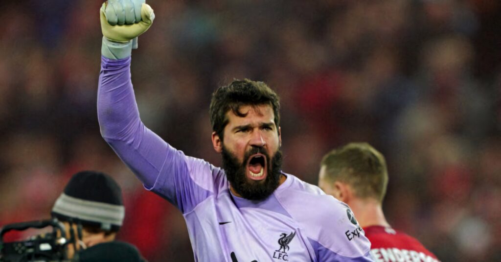 Alisson Becker Liverpool goalkeeper fist raised celebrating intense determined action wallpaper