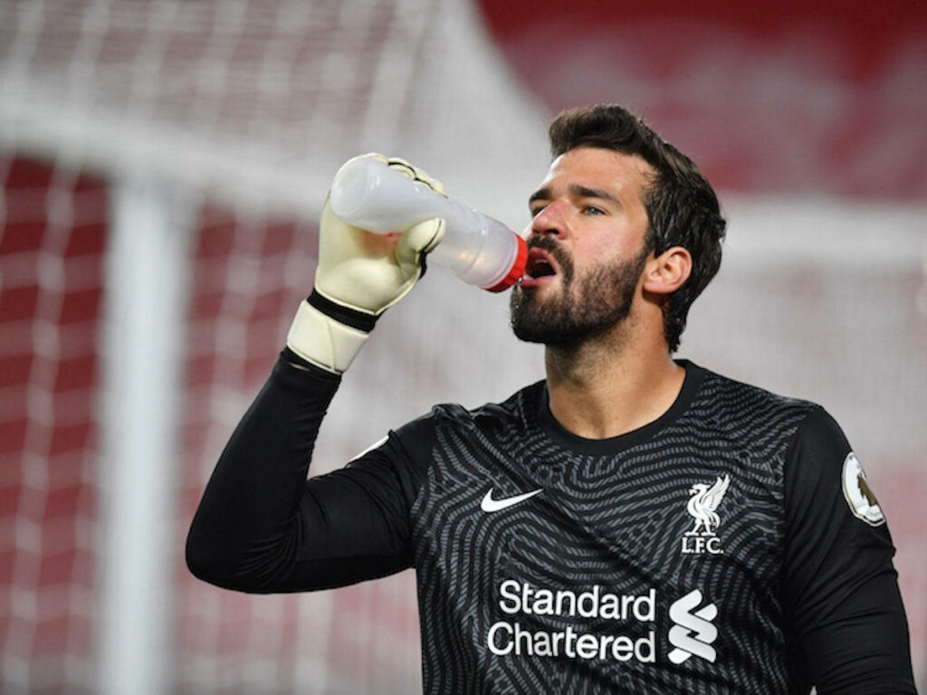 Alisson Becker Liverpool goalkeeper drinking water during football match wallpaper background