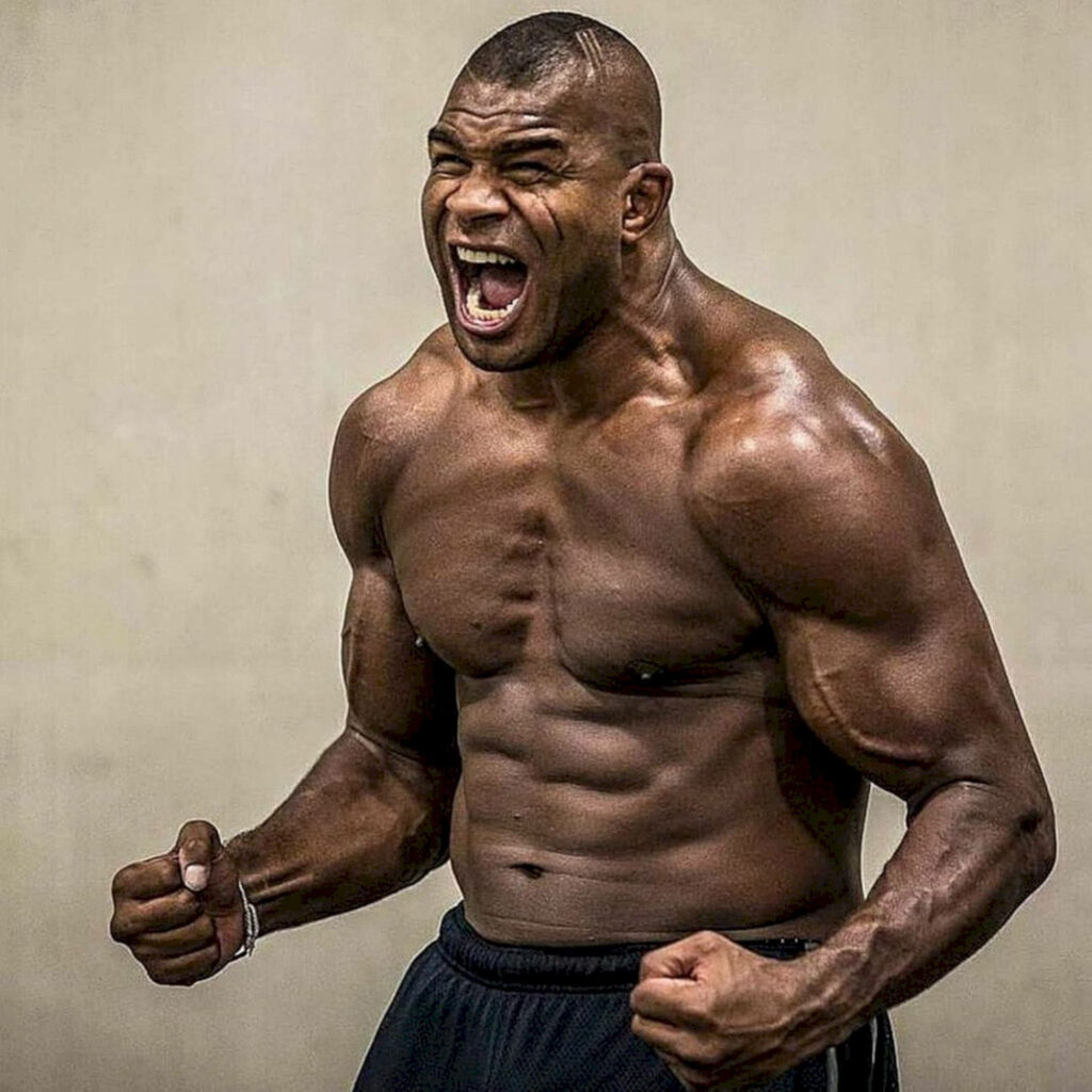 Alistair Overeem MMA fighter flexing muscles and screaming showing power and fierce determination Wallpaper