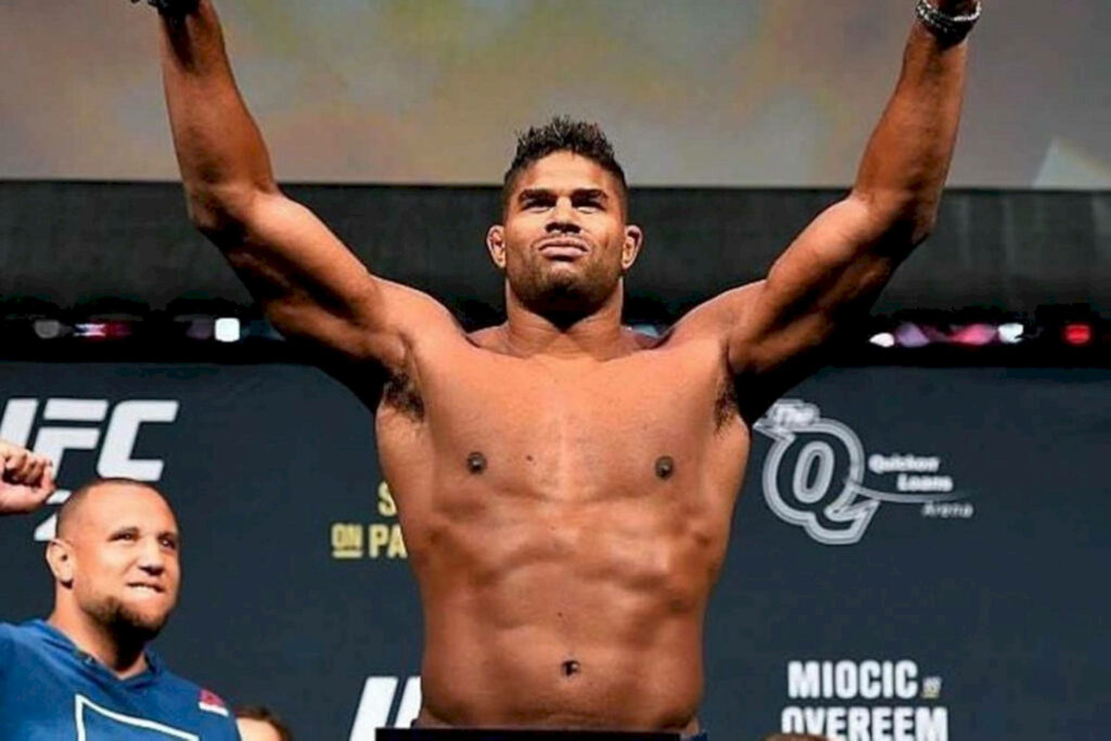 Alistair Overeem victorious on stage flexing muscular physique and fighting spirit wallpaper