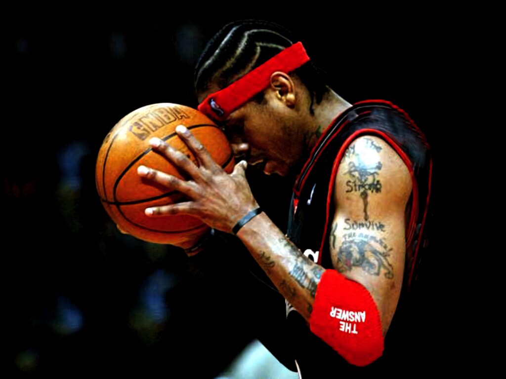 Allen Iverson intense basketball focus showing tattoos determination NBA court wallpaper background