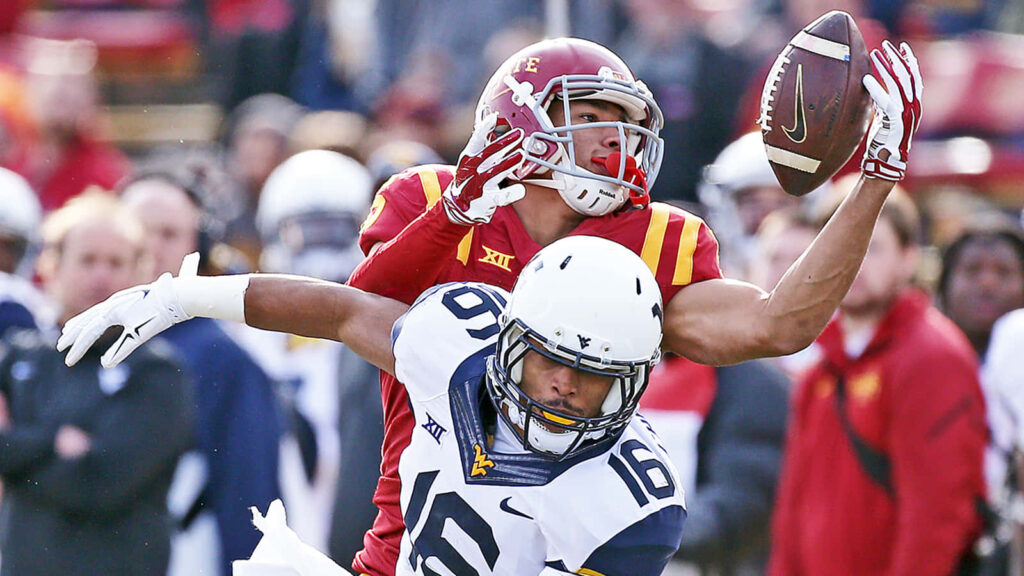 Allen Lazard making an impressive college football catch showcasing athletic skill and competition Wallpaper