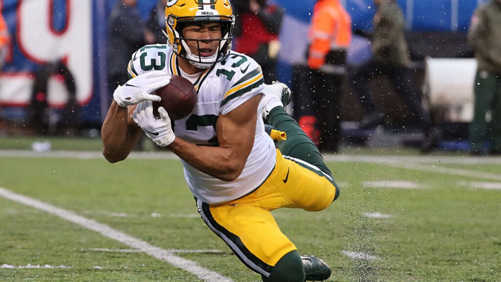 Allen Lazard Green Bay Packers dynamic catch intense football game action wallpaper background