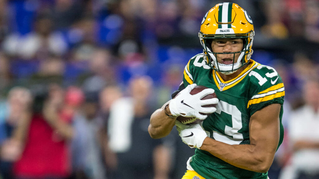 Allen Lazard Green Bay Packers receiver running with football focused in action on field wallpaper