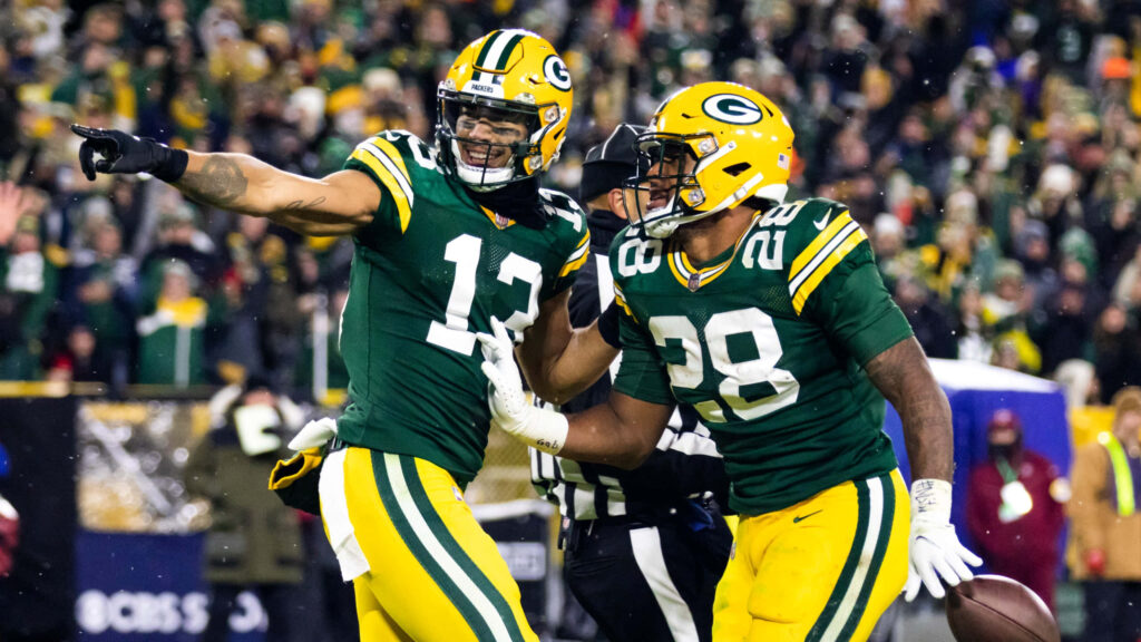Allen Lazard Green Bay Packers touchdown celebration with teammate on field and cheering crowd Wallpaper