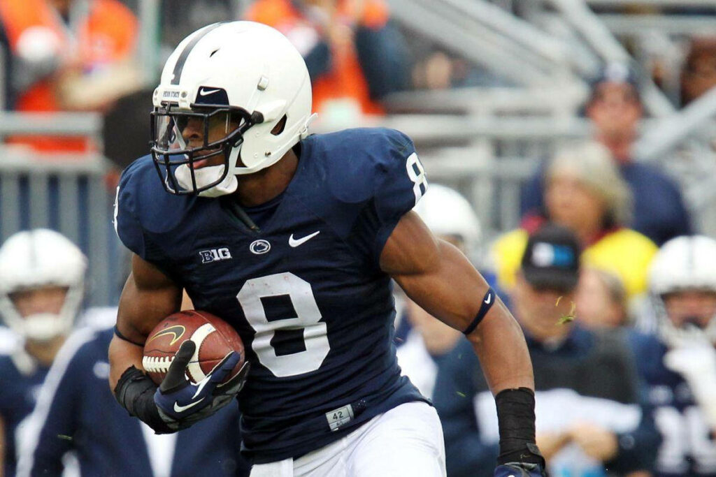 Allen Robinson running with football in NFL game showing athleticism and determination wallpaper