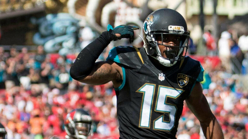Allen Robinson in Jacksonville Jaguars uniform catching football showing athleticism and intensity Wallpaper