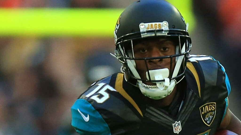 Allen Robinson in Jacksonville Jaguars uniform focused during intense American football game action Wallpaper