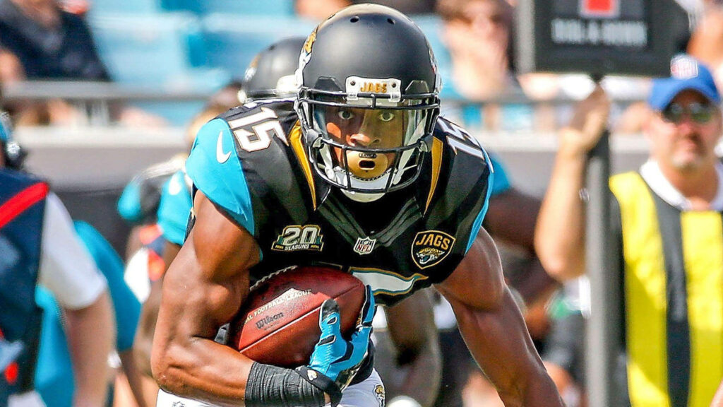 Allen Robinson in Jacksonville Jaguars uniform running with football NFL game action wallpaper