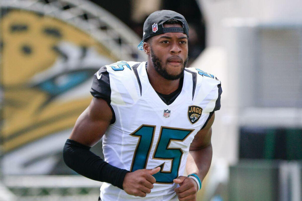 Allen Robinson in Jacksonville Jaguars No 15 jersey and backward cap on NFL field wallpaper background