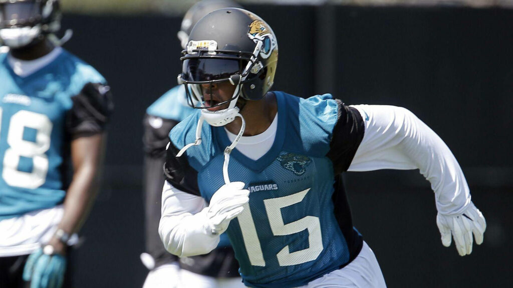 Allen Robinson in Jacksonville Jaguars uniform practicing on field intense American football action wallpaper