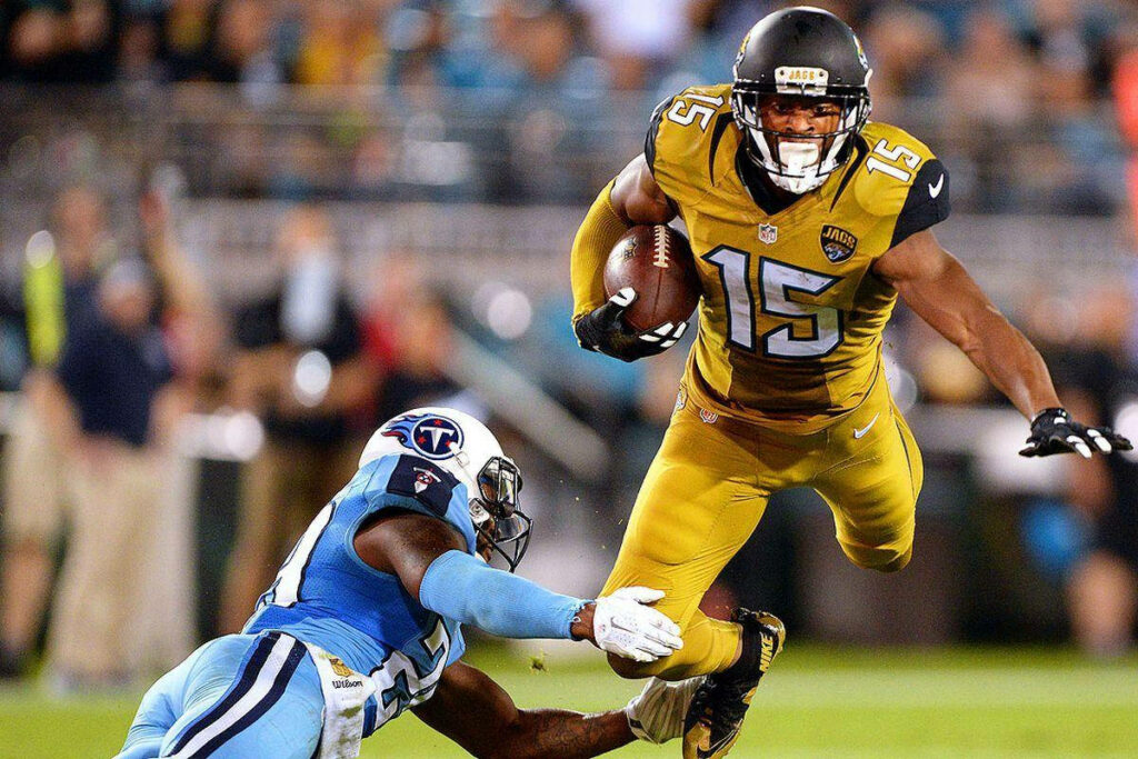 Allen Robinson of Jacksonville Jaguars sprinting past Tennessee Titans defender NFL game action Wallpaper
