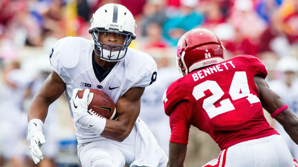 Allen Robinson Nittany Lions running football evade defender NCAA intense game wallpaper