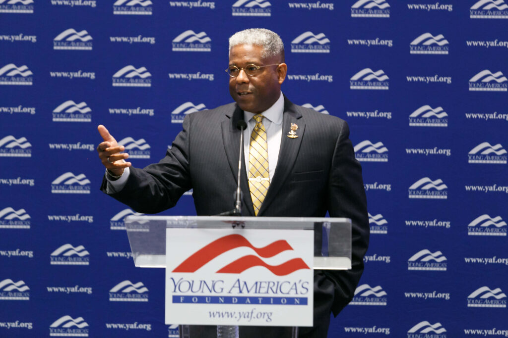 Allen West speaking at Young Americas Foundation event behind podium with branded backdrop Wallpaper
