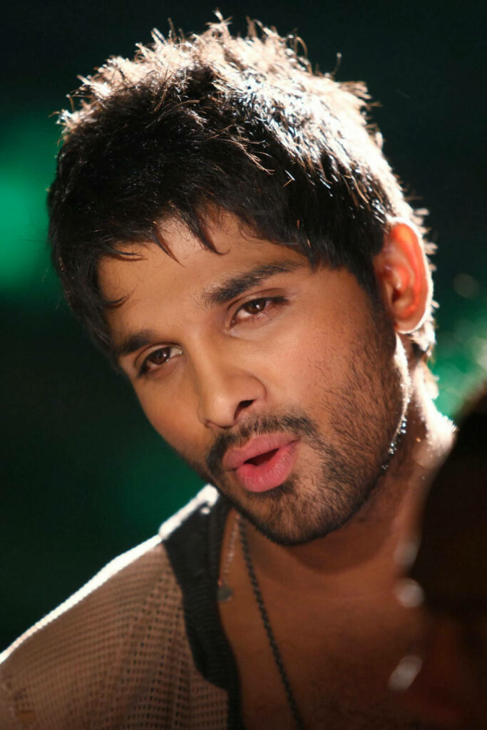 Close-up of Allu Arjun in tank top showcasing expressive look and stylish appearance wallpaper