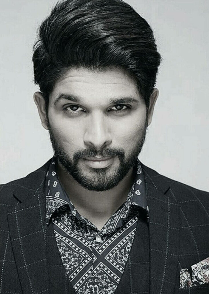Allu Arjun confident pose patterned shirt checkered blazer charismatic wallpaper background