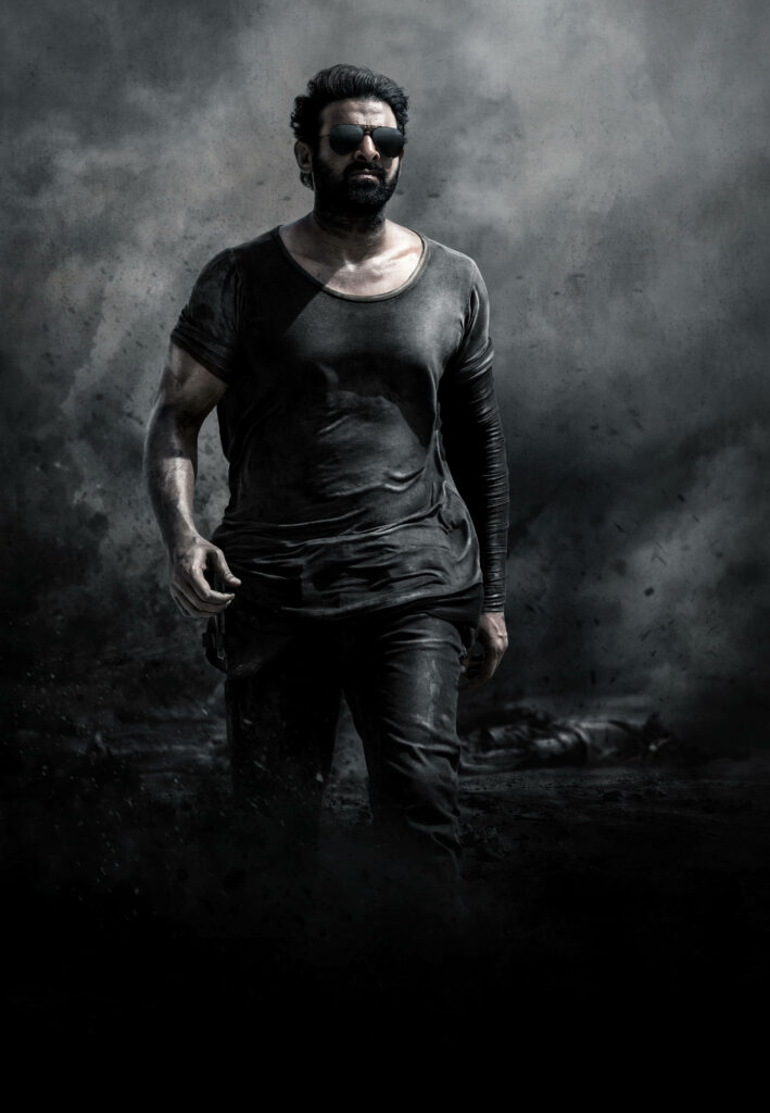 Allu Arjun intense Pushpa dark portrait wallpaper in gritty setting showing bold confident stance