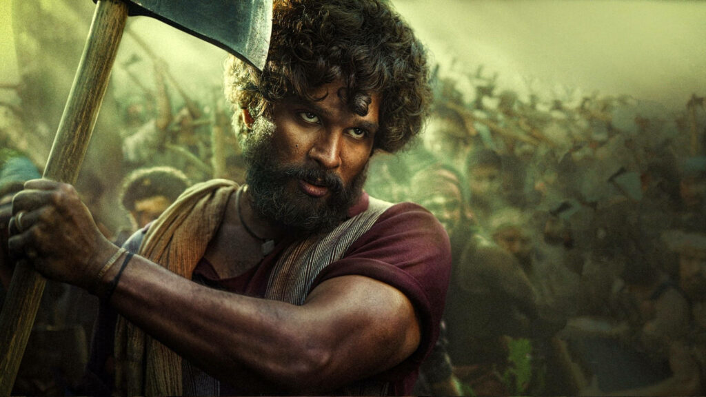 Allu Arjun as Pushpa holding axe fiercely in forest with determined crowd wallpaper background