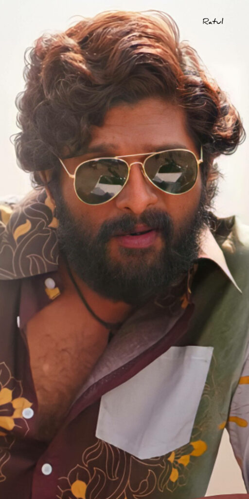 Allu Arjun as Pushpa Raj in green floral shirt and sunglasses confident dynamic wallpaper background